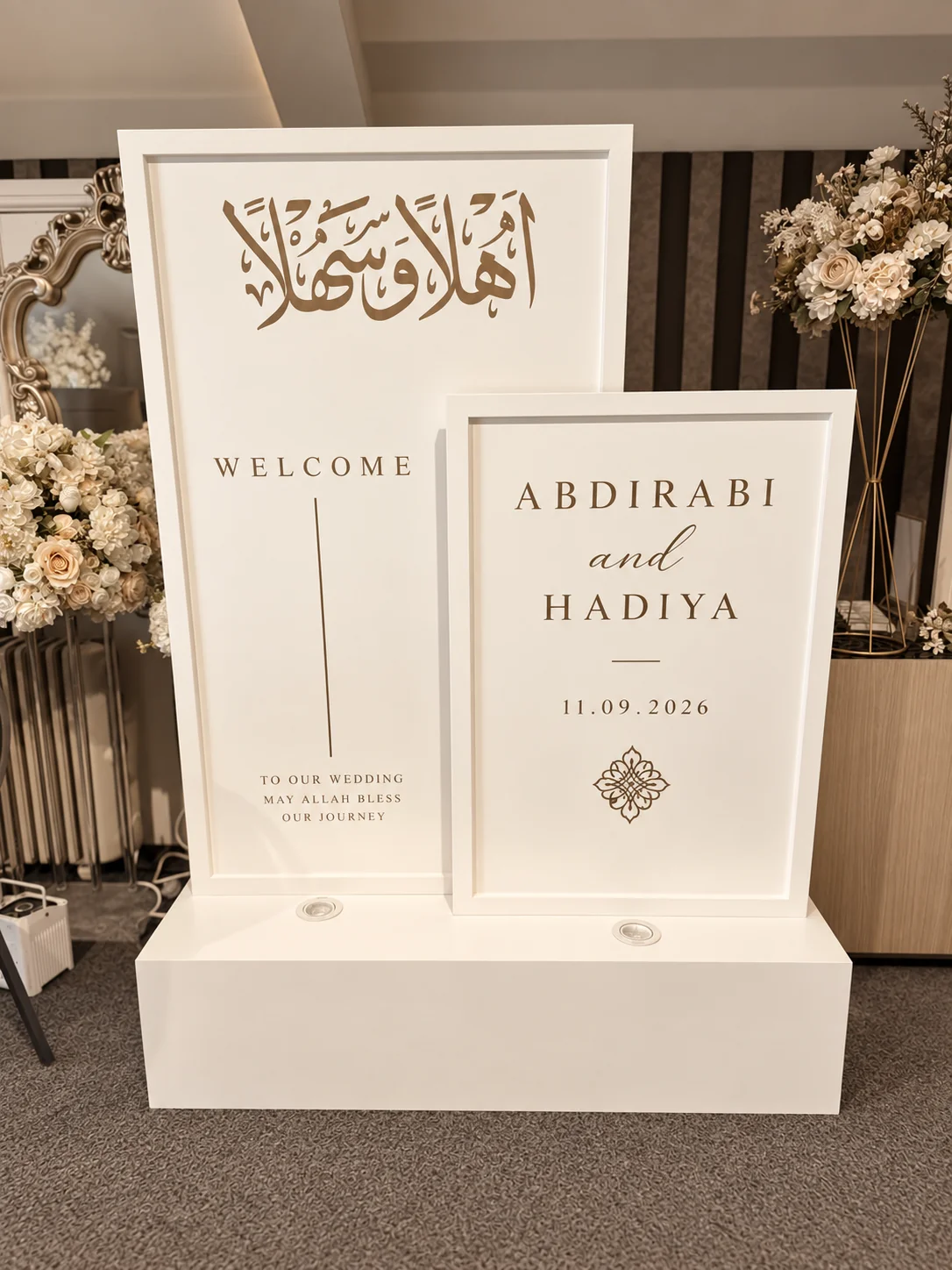 Coordinated framed welcome signs in a taupe and ivory colour treatment