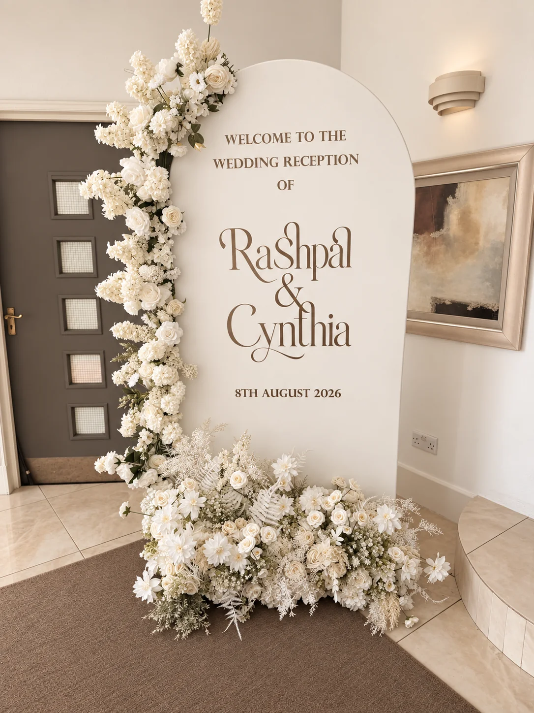 Floral wedding reception welcome board in a taupe and ivory colour treatment